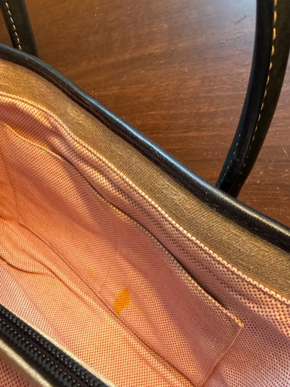 Dooney and Bourke Signature Logo
